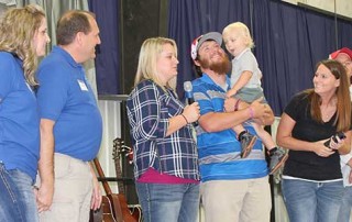 Kayla and Casey Jones receiving Overcomer Award